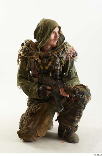 Photos John Hopkins Army Postapocalyptic Suit Poses kneeling whole body…